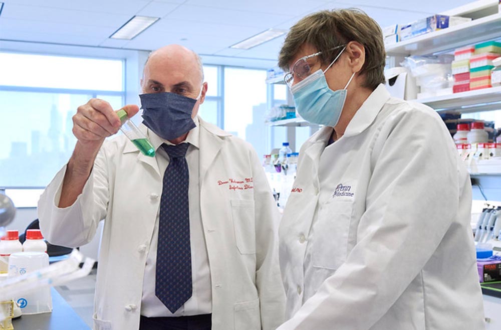 Katalin Karikó, PhD, and Drew Weissman, MD, PhD in lab with MRNA vaccine